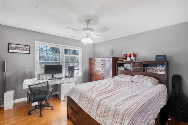 4983 Arcado Rd SW, Lilburn, GA 30047 - bedroom with ceiling fan, light wood finished floors, and baseboards