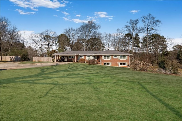 4983 Arcado Rd SW, Lilburn, GA 30047 - exterior space featuring driveway, a front yard, and fence