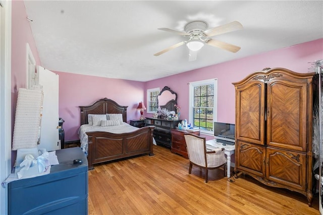 4983 Arcado Rd SW, Lilburn, GA 30047 - bedroom featuring light wood-style flooring and a ceiling fan