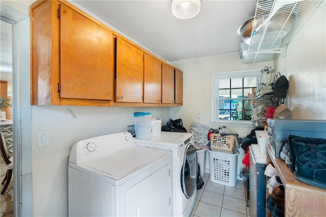 4983 Arcado Rd SW, Lilburn, GA 30047 - washroom featuring light tile patterned floors, washing machine and clothes dryer, and cabinet space