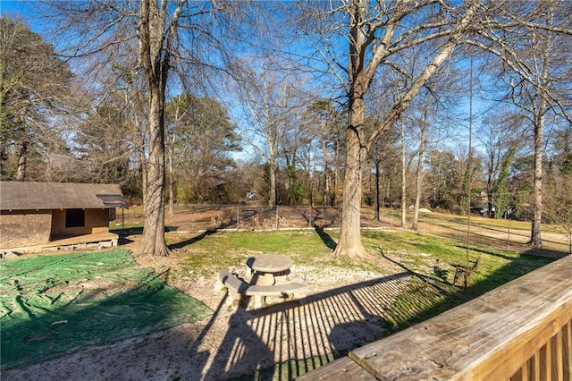 4983 Arcado Rd SW, Lilburn, GA 30047 - view of yard with fence, a fire pit, and an outdoor structure