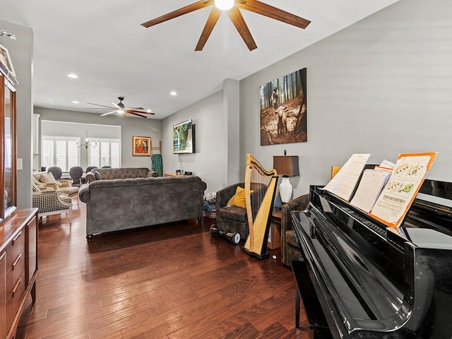 living room featuring dark wood-style floors, ceiling fan with notable chandelier, and recessed lighting