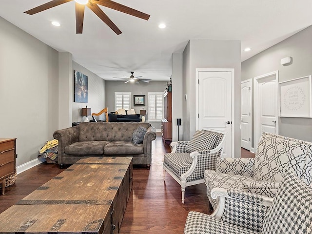 living room with dark wood-style floors, baseboards, and recessed lighting