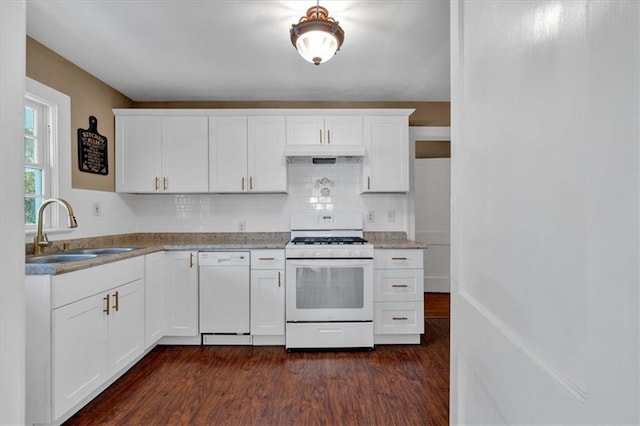 kitchen with sink, white cabinets, dark hardwood / wood-style flooring, decorative backsplash, and white appliances