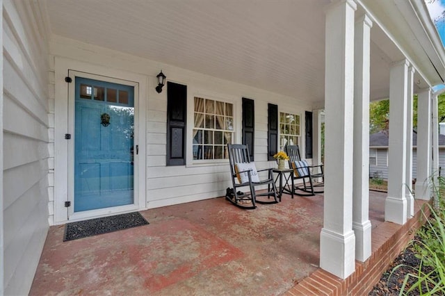 doorway to property featuring covered porch