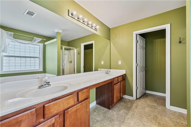 bathroom with vanity and an enclosed shower