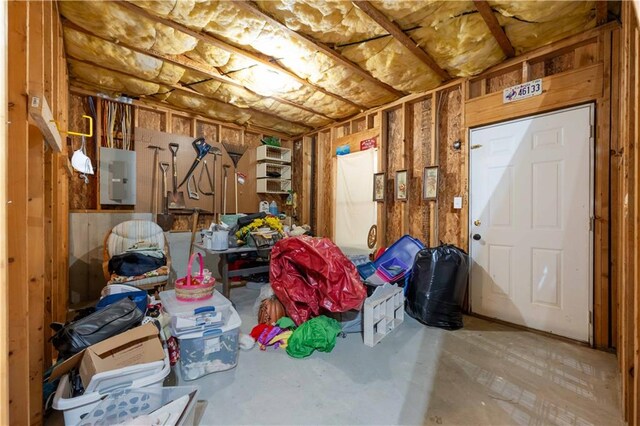 miscellaneous room featuring concrete flooring and electric panel