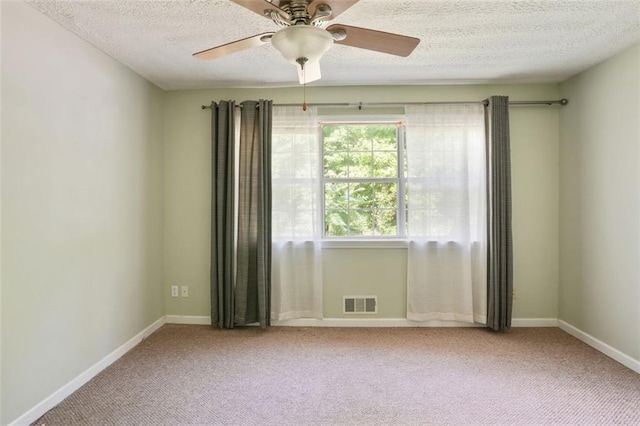 2026 Mcdaniel Mill Rd SW, Conyers, GA 30094 - empty room with carpet, a textured ceiling, ceiling fan, and baseboards