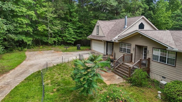 2026 Mcdaniel Mill Rd SW, Conyers, GA 30094 - view of front of home featuring concrete driveway, a shingled roof, and a front lawn
