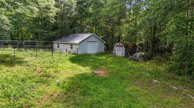 2026 Mcdaniel Mill Rd SW, Conyers, GA 30094 - view of yard with a garage and a view of trees
