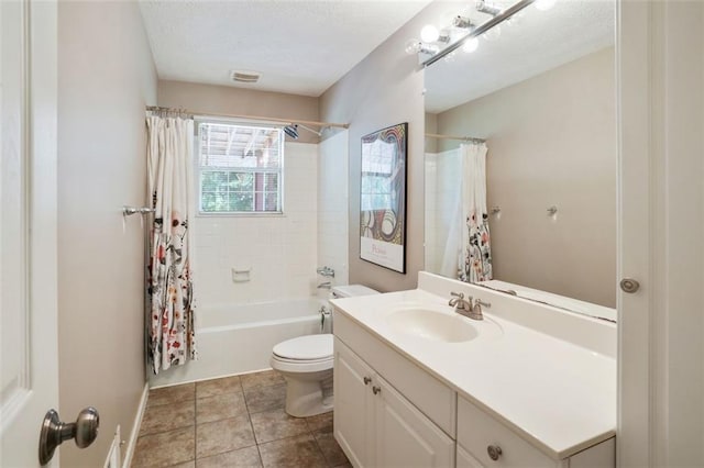 2026 Mcdaniel Mill Rd SW, Conyers, GA 30094 - bathroom featuring vanity, toilet, shower / bath combo with shower curtain, tile patterned flooring, and a textured ceiling
