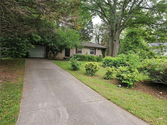 ranch-style home with a front lawn and driveway