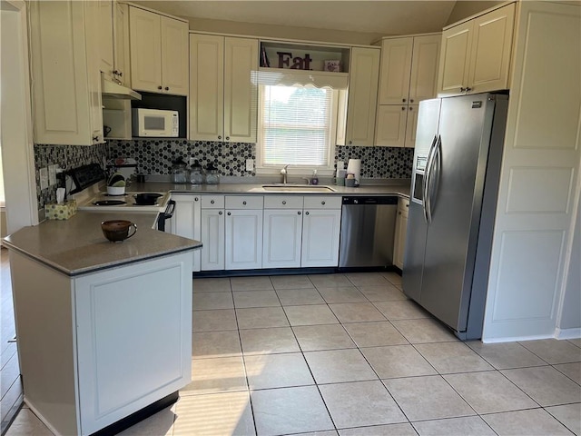 238 Marks Rd, Mansfield, GA 30055 - kitchen with stainless steel appliances, decorative backsplash, under cabinet range hood, light tile patterned flooring, and a peninsula