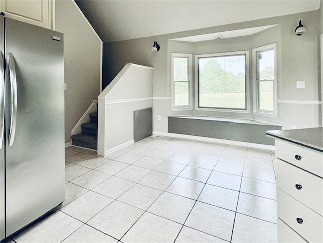 238 Marks Rd, Mansfield, GA 30055 - kitchen with freestanding refrigerator, light tile patterned flooring, and dark countertops