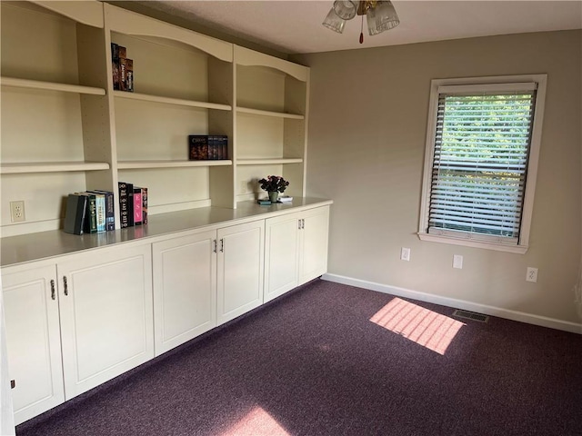 238 Marks Rd, Mansfield, GA 30055 - unfurnished dining area with dark colored carpet and ceiling fan