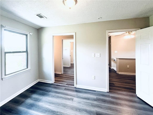 238 Marks Rd, Mansfield, GA 30055 - unfurnished bedroom featuring a textured ceiling and wood finished floors