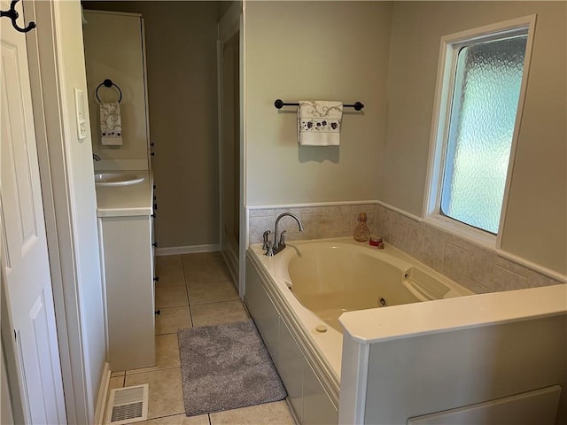 238 Marks Rd, Mansfield, GA 30055 - bathroom with tile patterned floors, a whirlpool tub, and vanity