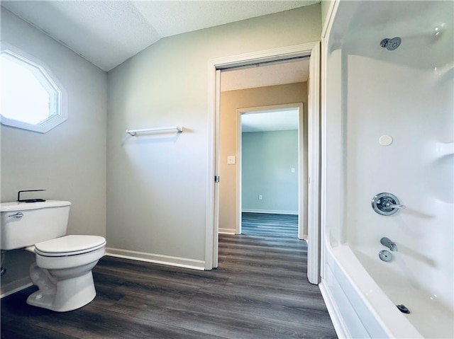 238 Marks Rd, Mansfield, GA 30055 - full bathroom with wood finished floors, bathtub / shower combination, and lofted ceiling