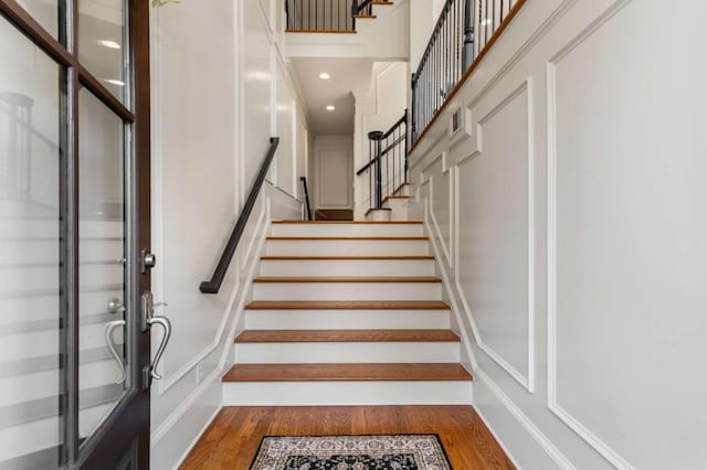 stairway featuring hardwood / wood-style floors