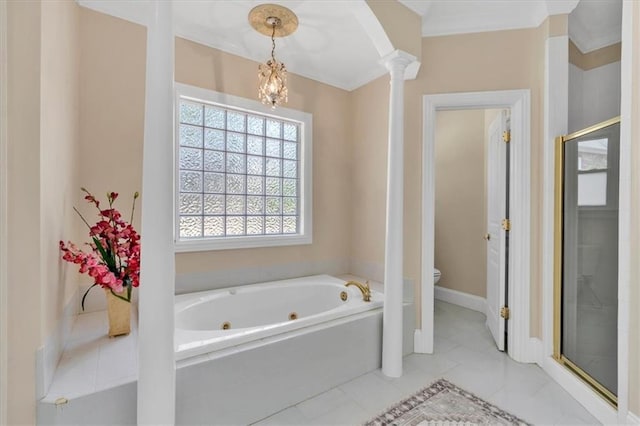 bathroom featuring toilet, a tub with jets, a stall shower, and decorative columns