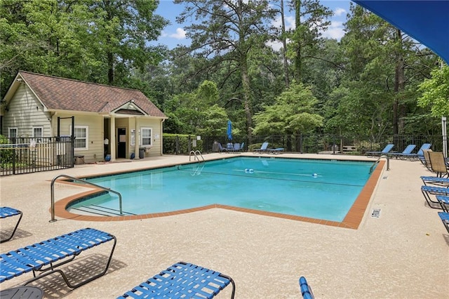 3650 Ashford Dunwoody Rd NE Unit 1024, Atlanta, GA 30319 - community pool featuring a patio and view of wooded area