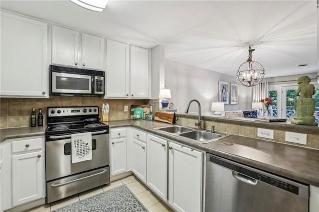 3650 Ashford Dunwoody Rd NE Unit 1024, Atlanta, GA 30319 - kitchen featuring appliances with stainless steel finishes, tasteful backsplash, and white cabinets