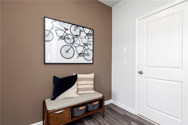living area featuring dark wood finished floors and baseboards