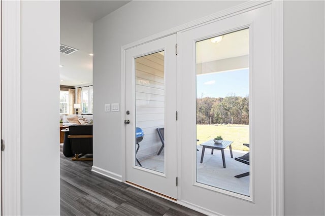 entryway with dark wood-style floors