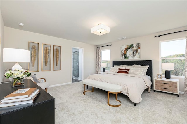 carpeted bedroom featuring baseboards