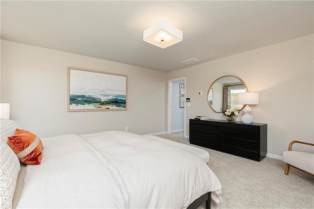 bedroom featuring carpet and baseboards