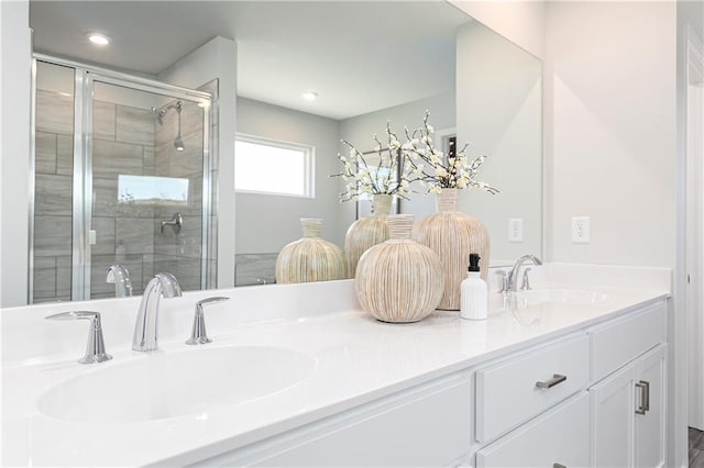 full bath with a stall shower and double vanity