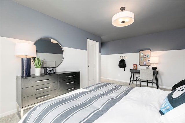 carpeted bedroom featuring baseboards
