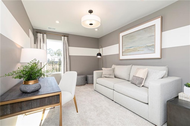living area featuring carpet floors and recessed lighting
