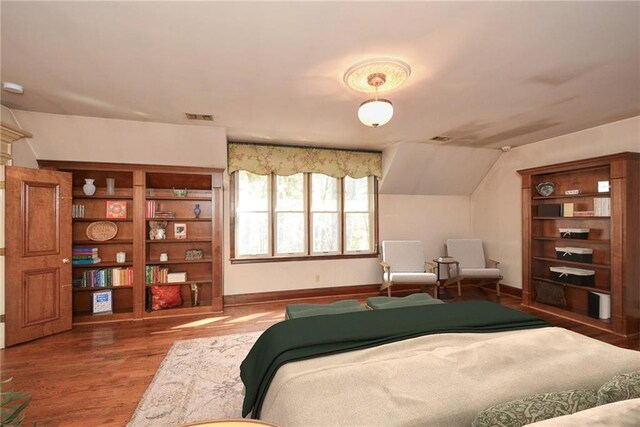 unfurnished living room featuring wood walls, french doors, wood-type flooring, and an inviting chandelier