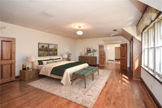 unfurnished room featuring dark hardwood / wood-style flooring, an inviting chandelier, and wood walls