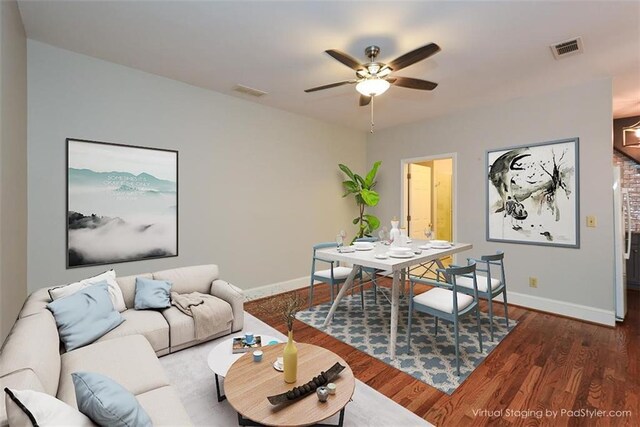 living room featuring wooden walls, french doors, hardwood / wood-style flooring, and an inviting chandelier