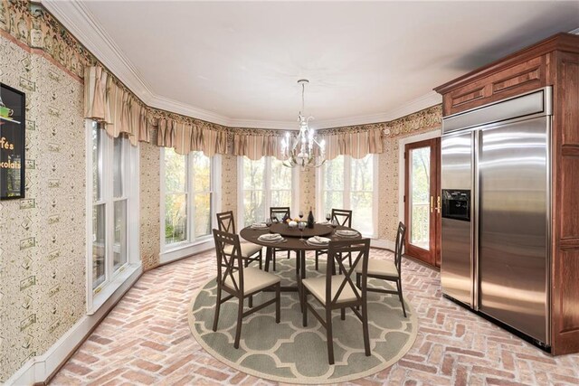 kitchen with sink, a kitchen island, crown molding, and stainless steel appliances