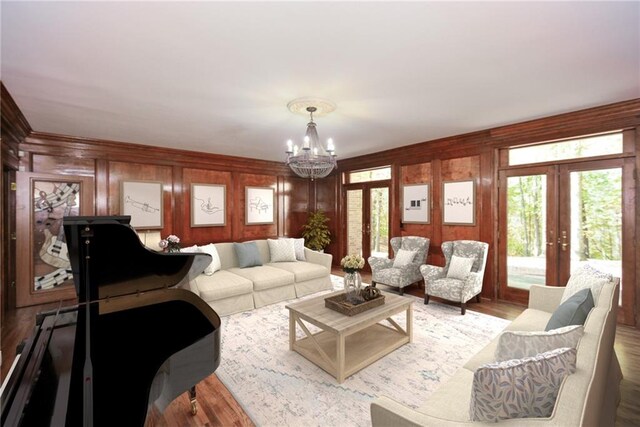 kitchen with appliances with stainless steel finishes, ornamental molding, sink, light hardwood / wood-style flooring, and a center island