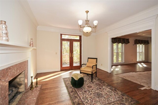 dining room featuring dark wood-type flooring, an inviting chandelier, and ornamental molding