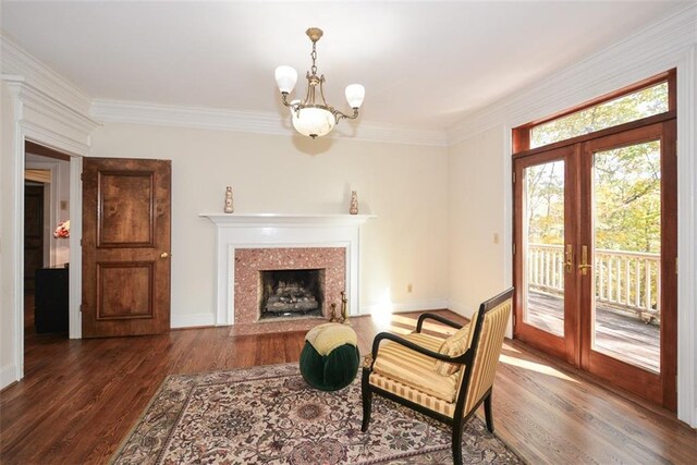 dining room with plenty of natural light, dark hardwood / wood-style flooring, and crown molding