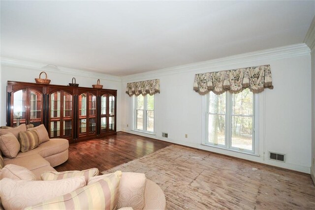 sitting room with crown molding, french doors, and dark wood-type flooring