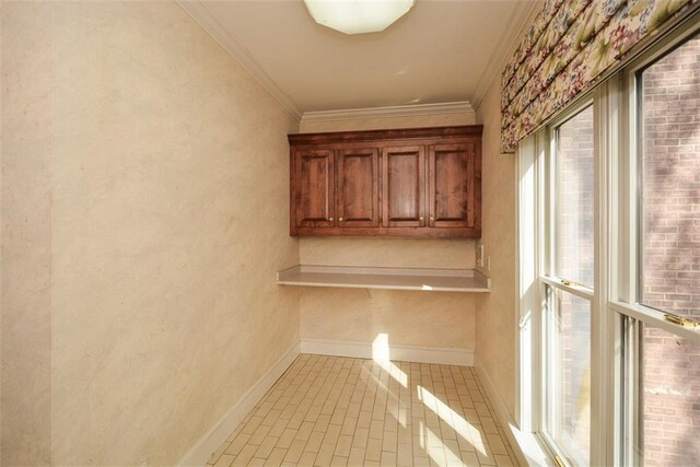 bathroom featuring tiled bath, tile patterned floors, and crown molding