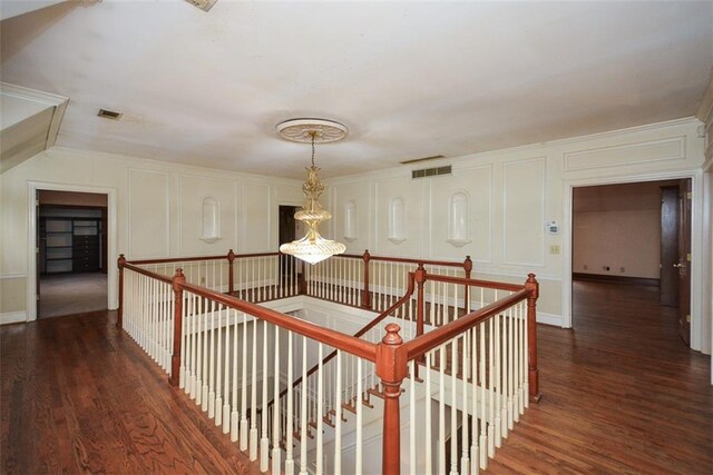 walk in closet with light carpet and vaulted ceiling