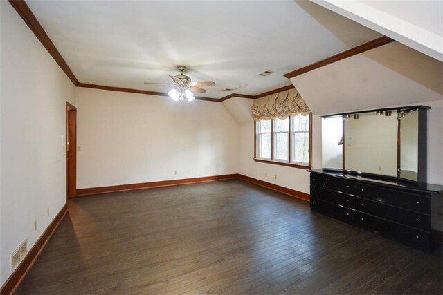 unfurnished living room with ceiling fan, crown molding, and dark wood-type flooring