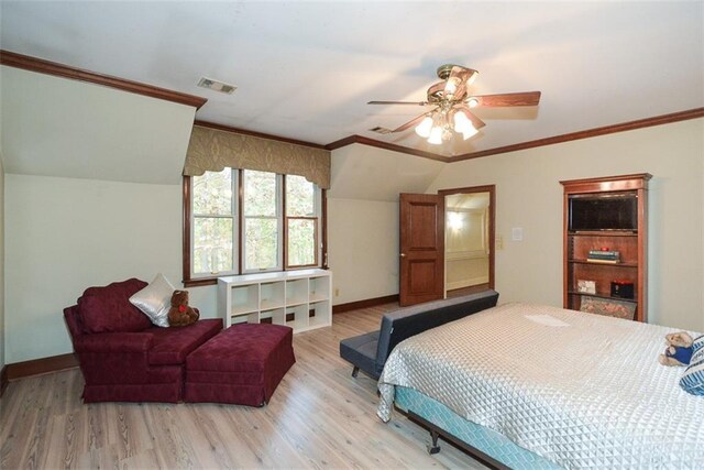 interior space with ceiling fan, light colored carpet, and crown molding