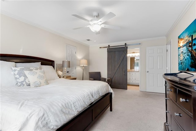 carpeted bedroom with ornamental molding, a barn door, connected bathroom, and ceiling fan