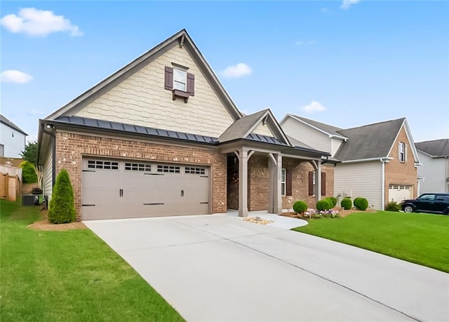 4547 Big Rock Ridge Trl SW, Gainesville, GA 30504 - view of front facade with brick siding, a front yard, concrete driveway, and a standing seam roof