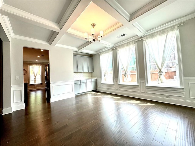 unfurnished living room with beamed ceiling, visible vents, an inviting chandelier, and dark wood-style floors