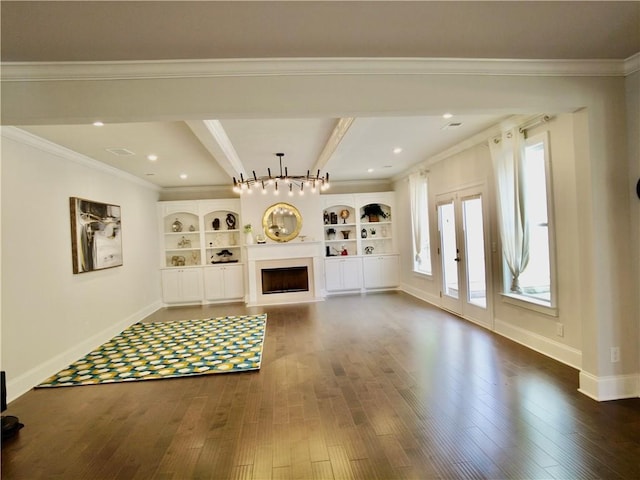 unfurnished living room featuring crown molding, baseboards, a fireplace, and dark wood finished floors
