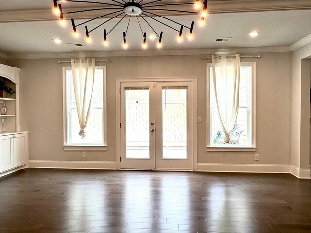 interior space with french doors, visible vents, crown molding, and dark wood-style floors